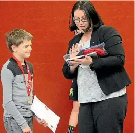  ?? EMMA JAMES ?? Tauwhare School student Liam Wells is presented with his Sir Peter Blake award by Westpac’s Toni Mills.