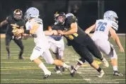  ?? BARRY BOOHER — FOR THE NEWS-HERALD ?? Riverside’s Matt Watson pursues South QB Colin Quinlan during the Beavers’ 30-0 win Aug. 28.