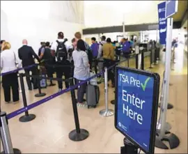  ?? Robert Gauthier Los Angeles Times ?? NEARLY 9 million f liers have paid $85 apiece to use TSA PreCheck lines at more than 200 airports across the country. There were 2.7 million members in 2016.