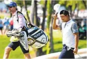  ?? EMIL LIPPE AP ?? K.H. Lee tips his cap while walking onto the 18th green at the AT&T Byron Nelson on Sunday.