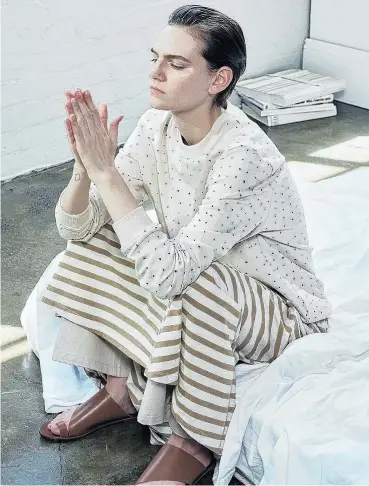 ?? PHOTOS: SUPPLIED ?? Kowtow Boat Dress with tan stripe, layered with a cotton pants, crew neck sweater and tan sandals.
