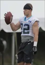  ?? CHUCK BURTON — THE ASSOCIATED PRESS ?? The Panthers’ Christian McCaffrey waits to return a kick during practice at the team’s training camp at Wofford College in Spartanbur­g, S.C.