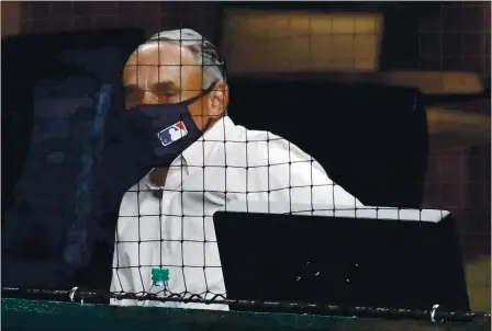  ?? RONALD MARTINEZ — GETTY IMAGES ?? Baseball commission­er Rob Manfred is excited about some of the changes made to the game during this pandemic-shortened season.