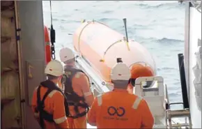  ?? OCEAN INFINITY/AFP ?? An autonomous underwater vehicle, one of eight used for the hunt of Malaysia Airlines flight MH370 that went missing in 2014, being deployed at sea.