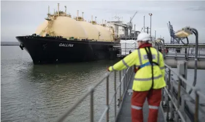  ?? Rochester. Photograph: Bloomberg/Getty Images ?? An employee looks towards the Gallina liquefied natural gas tanker after docking at National Grid’s Grain plant on the Isle of Grain in