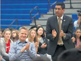  ??  ?? Steve Kerr was joined in the gym by Rep. Ro Khanna, right. Kerr has been an outspoken advocate for stricter gun control and a critic of President Donald Trump and his policies.