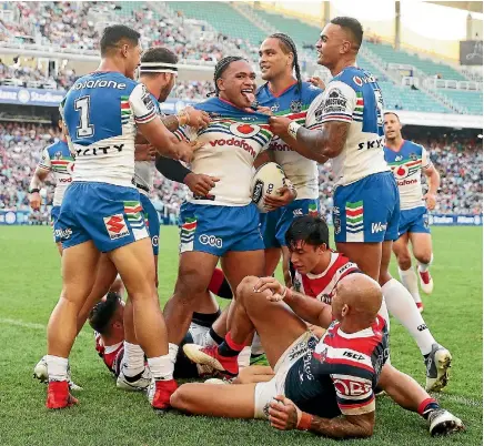  ?? PHOTO: GETTY IMAGES ?? Solomone Kata of the Warriors celebrates with team-mates after scoring a try against the Sydney Roosters at Allianz Stadium on Saturday.