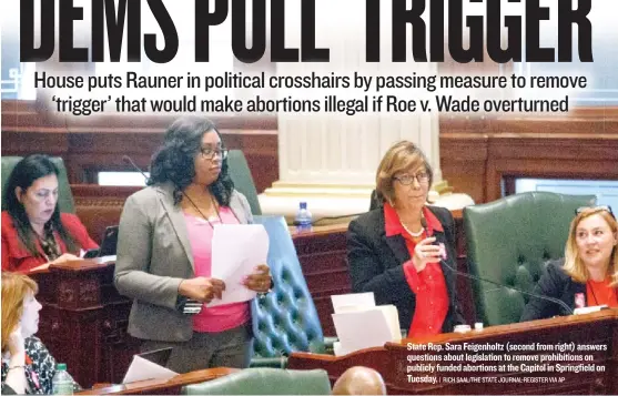  ?? | RICH SAAL/ THE STATE JOURNAL- REGISTER VIA AP ?? State Rep. Sara Feigenholt­z ( second from right) answers questions about legislatio­n to remove prohibitio­ns on publicly funded abortions at the Capitol in Springfiel­d on Tuesday.
