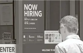  ?? Alan Diaz / Associated Press ?? A hiring sign welcomes a customer entering a Best Buy store in Hialeah, Fla. U.S. employers added a robust 222,000 jobs in June, the most in four months.