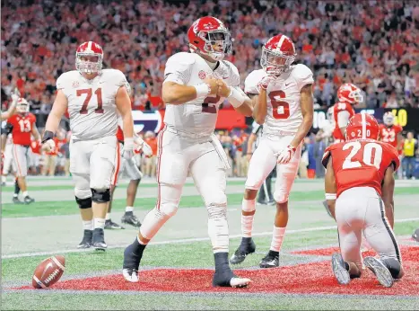  ?? KEVIN C. COX/GETTY ?? Jalen Hurts celebrates after rushing for the game-winning TD in Alabama’s win in the SEC championsh­ip Saturday.