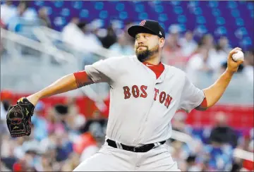  ?? Lynne Sladky ?? The Associated Press Red Sox pitcher Brian Johnson became the fifth straight Boston starter to allow fewer than two runs to start the season, allowing one run in six innings of a 7-3 victory over the Marlins on Monday in Miami.