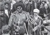  ?? AP FILE PHOTO BY CHARLES W. HARRITY ?? Elbert “Big Man” Howard, deputy minister of informatio­n for the Black Panther Party, speaks at a sidewalk news conference in Washington in 1970. Howard, was one of the six founding members of the Black Panther Party. His wife, Carole Hyams, said Howard...