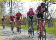  ??  ?? Schär face: the Swiss rider shows the strain of riding the Roubaix pavé