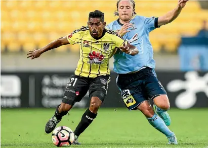  ?? PHOTO: GETTY IMAGES ?? Roy Krishna of the Phoenix and Rhyan Grant of Sydney FC compete for a loose ball during the match yesterday.
