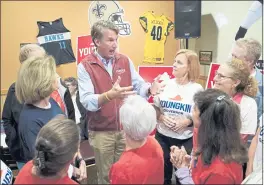  ?? STEVE HELBER — THE ASSOCIATED PRESS ?? Glenn Youngkin, a Republican candidate for governor of Virginia, greets supporters at a sports bar in Chesapeake, Va.