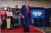  ?? MIKE ROEMER/THE ASSOCIATED PRESS ?? Republican presidenti­al candidate former President Donald Trump takes the stage before speaking Tuesday, April 2, at a rally in Green Bay, Wis.