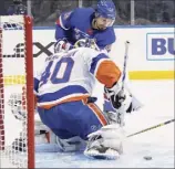  ?? Bruce Bennett / Associated Press ?? Chris Kreider of the Rangers can’t get the puck past Islanders goalie Semyon Varlamov in the second period Thursday.