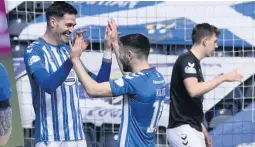  ??  ?? GAME FOR A LAFF Broadfoot hails Lafferty after Northern Irishman bags the opener