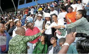  ?? Picture: Supplied ?? Gauteng premier Panyaza Lesufi greets teacher assistants on February 11, when the provincial government handed over appointmen­t letters to them at Dobsonvill­e Stadium in Soweto.