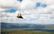  ?? Green Renaissanc­e / World Wildlife Fund ?? A black rhino is transporte­d by helicopter in South Africa. Black rhinos are an endangered species.