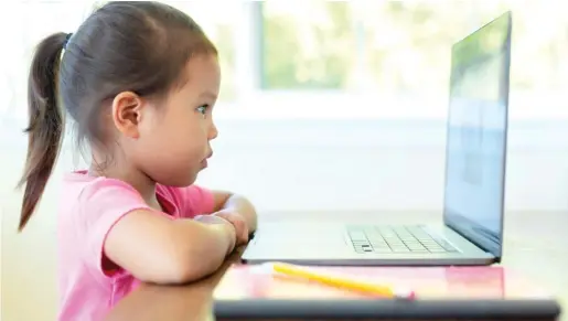  ?? STOCK.ADOBE.COM ?? Pandemic quarantini­ng has pushed parents working remotely to relax their children’s screen time rules as kids were thrust into online schooling.