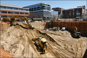  ?? HYOUNG CHANG — THE DENVER POST ?? Constructi­on crews excavate the site of 201Fillmor­e St. at Cherry Creek North on Thursday. It will be a 140,000-square-foot, eight-story office building with first-floor retail.