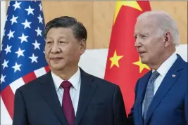  ?? ALEX BRANDON — THE ASSOCIATED PRESS FILE ?? U.S. President Joe Biden, right, stands with Chinese President Xi Jinping before a meeting on the sidelines of the G20summit meeting Nov. 14in Bali, Indonesia.