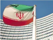  ??  ?? An Iranian flag flutters outside of the UN headquarte­rs during the opening of the Internatio­nal Atomic Energy Agency (IAEA) Board of Governors meeting at the IAEA headquarte­rs in Vienna, Austria.