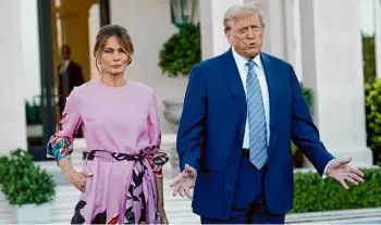  ?? Lynne Sladky/Associated Press ?? Former President Donald Trump, right, stands with his wife, Melania Trump, as they arrive for a GOP fundraiser on April 6 in Palm Beach, Fla.