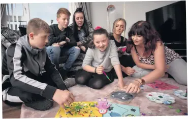  ??  ?? Solid bond: (from left) James, Rio, Dionne, Codie, Chloe and Danielle at home, and (right) Julie Lowry