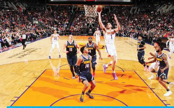  ??  ?? PHOENIX: Devin Booker #1 of the Phoenix Suns shoots the ball during the game against the Denver Nuggets at Talking Stick Resort Arena in Phoenix, Arizona. — AFP