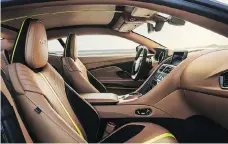  ??  ?? The interior is swathed in Dark Knight leather with lime-coloured detailing.