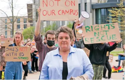  ?? ?? Hostile welcome: Julie Bindel is met by activists as she arrives at York University yesterday