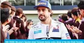  ??  ?? ABU DHABI: McLaren’s Spanish driver Fernando Alonso walks ahead of the Abu Dhabi Formula One Grand Prix at the Yas Marina circuit on Sunday, in Abu Dhabi. — AFP