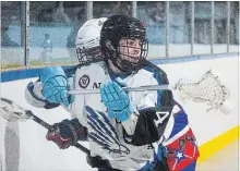  ?? JULIE JOCSAK THE ST. CATHARINES STANDARD ?? Niagara’s Trent Hunter, foreground, is defended by Welland’s Justin McPherson in junior B lacrosse earlier this month at Meridian Credit Union Arena in Virgil.