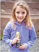  ?? ?? Trophy Culdees Castle egg hunt winner Fiona. Pic: Holeyn Photograph­y