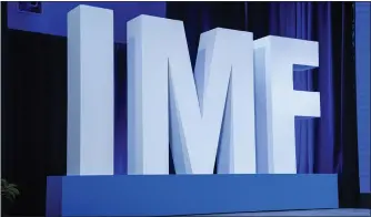  ?? JACQUELYN MARTIN — THE ASSOCIATED PRESS ?? The Internatio­nal Monetary Fund said Tuesday at its spring meetings in Washington that the world seems headed for a “soft landing,” forecastin­g inflation to go down to 5.9% this year.