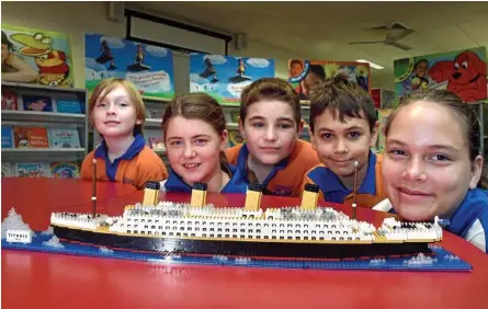  ?? Photo: Bev Lacey ?? CREATIVE CREATION: Gabbinbar State School students (from left) Jackson Grant, Annastacia Wenham, Taj Taylor, Riegan Charles and Emmi Weir helped build the model Titanic for the Lifeline Darling Downs fundraiser.