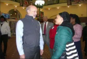  ?? KEVIN TUSTIN - DIGITAL FIRST MEDIA ?? Gov. Tom Wolf speaks with Alicia Medley of Philadelph­ia. Medley had voted for Wolf minutes before getting on her way to work for the day. She was excited to meet up with her candidate of choice as she made her way through 69th Street Transporta­tion Center Tuesday morning.