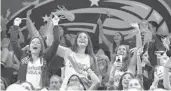  ?? STEPHEN M. DOWELL/ORLANDO SENTINEL ?? Fans are up in arms as they cheer during the Magic’s loss to the Chicago Bulls on Friday night at Amway Center.