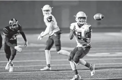  ?? Ronald Cortes / Contributo­r ?? Roosevelt’s Jalen Smothers picks off a pass during the Rough Riders’ 24-20 loss to Churchill on Friday at Heroes Stadium.