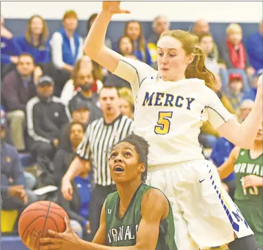  ?? John Nash/Hearst Connecticu­t Media / ?? Norwalk’s Naeve Rene pump fakes Mercy’s Isabella Santoro into the air Monday night in Middletown.