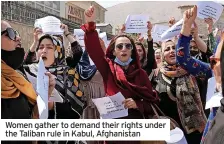  ??  ?? Women gather to demand their rights under the Taliban rule in Kabul, Afghanista­n