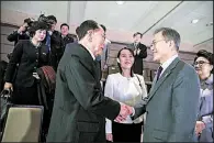  ?? AP ?? In this photo provided by the South Korea Presidenti­al Blue House, South Korean President Moon Jae-in (right) shakes hands with North Korea’s nominal head of state Kim Yong Nam as Kim Yo Jong (center), North Korean leader Kim Jong Un’s sister, watches...