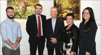  ?? Photo by Michelle Cooper Galvin ?? Peter O’Toole (third from
left) at the opening of his photograph­ic exhibition with Minister of State Brendan Griffin who officially opened the exhibition and his family Peter, Kari and Sarah at the Killarney House on Saturday.