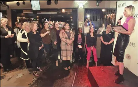  ?? Dan Watson/ The Signal ?? Women Empowering Women In Leadership founder Jen Abbott-aston (right) welcomes attendees during the Internatio­nal Women’s Day: Celebratin­g Women Near and Far event held at the Eighth & Rail Sports Bar in Newhall.