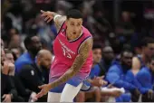  ?? PATRICK SEMANSKY — THE ASSOCIATED PRESS ?? Wizards forward Kyle Kuzma gestures after making a 3-point shot in the second half against the Mavericks on Thursday in Washington. Washington won 113-105.