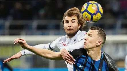  ?? — AP ?? Out of my way: Inter Milan’s Ivan Perisic (right) and Crotone’s Stefan Simic vying for the ball in the Serie A match at the San Siro on Saturday.