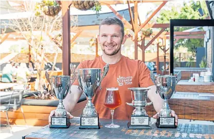  ??  ?? Steve Russell displaying his silverware fresh from the Perth Royal Beer Awards.