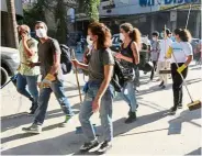  ?? — Locate Victims Beirut ?? (Above and left) Lebanese youth took to the streets of Beirut with friends and family early in the morning on the day after the blasts to help locate victims and the missing and clear up rubble.